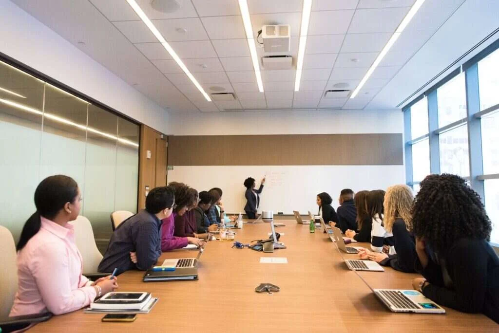 A professional in a consultation setting looking toward a colleague