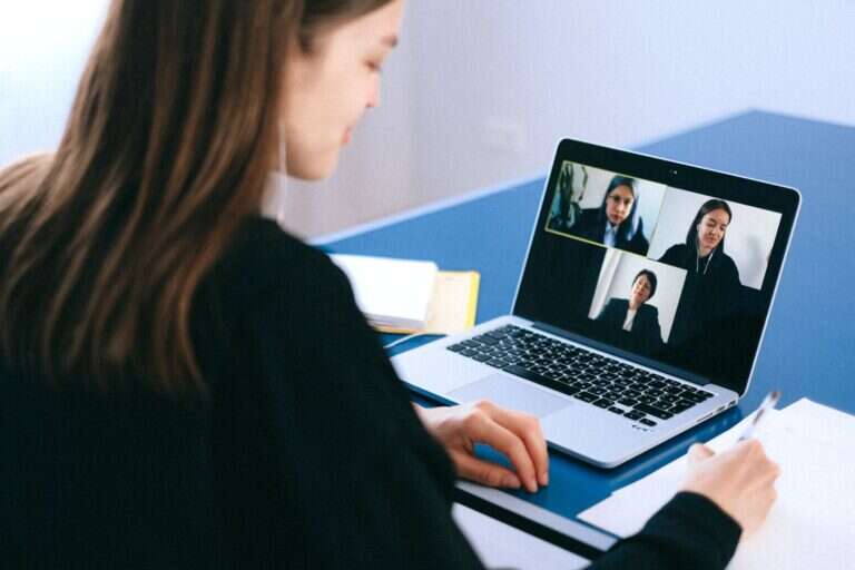 Professional reviewing and signing documents during a notary session